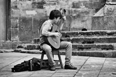 Guy playing acoustic